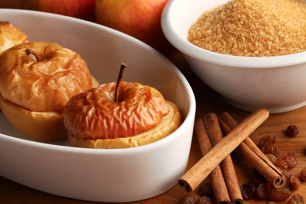 Baked apples on plate and ingredients. — Stock Photo, Image
