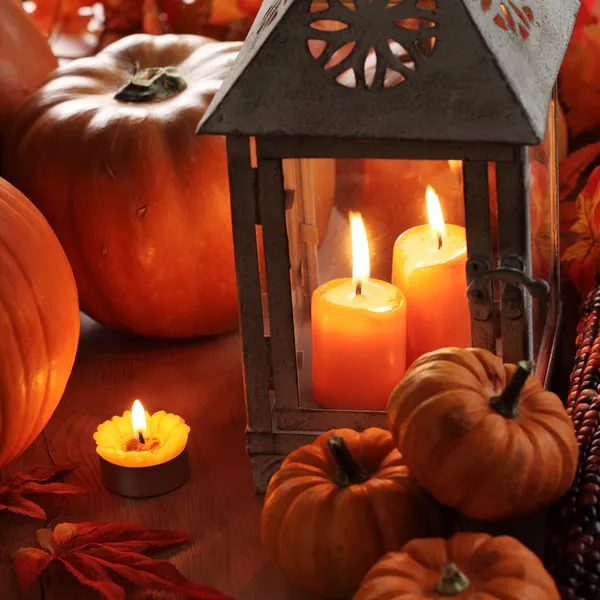 Lantern with burning candles and pumpkins — Stock Photo, Image