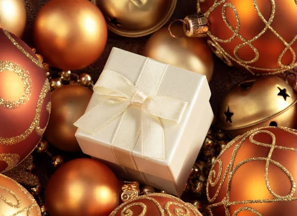 Close-up of Christmas ornaments and gift box. — Stock Photo, Image