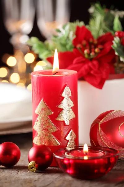 Candles and ornaments on holiday table Stock Image