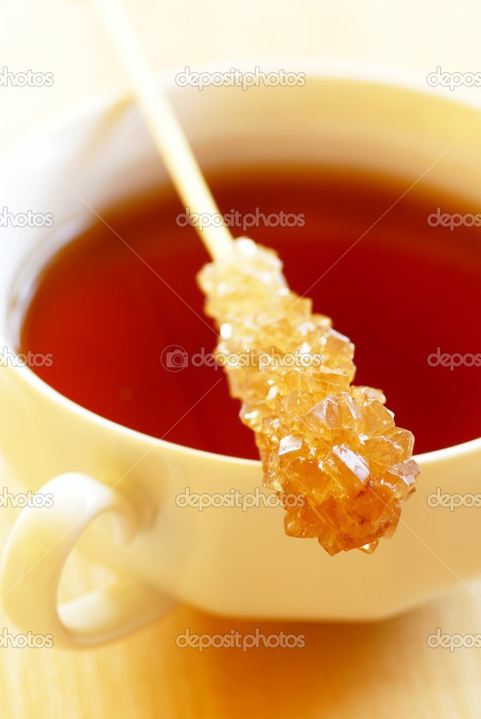Cup of tea and stick with brown sugar