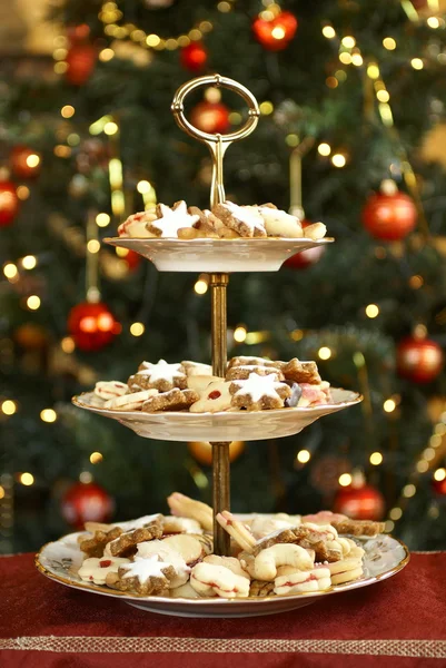 Christmas cookies on holiday plates — Stock Photo, Image