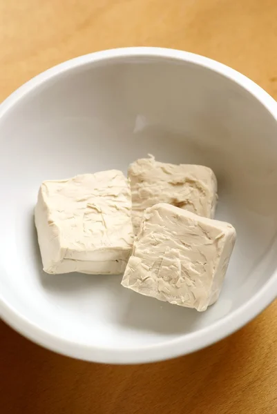 Baker's yeast in white bowl — Stock Photo, Image