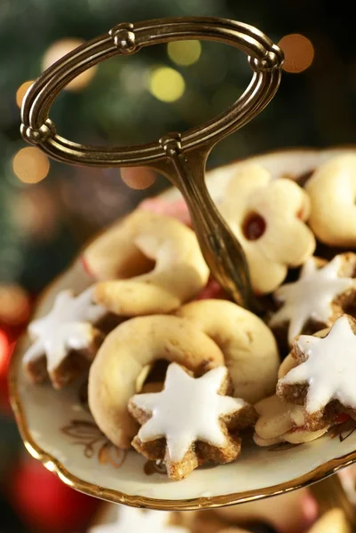 Christmas cookies on holiday plates — Stock Photo, Image