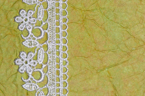 Green paper and lace — Stock Photo, Image