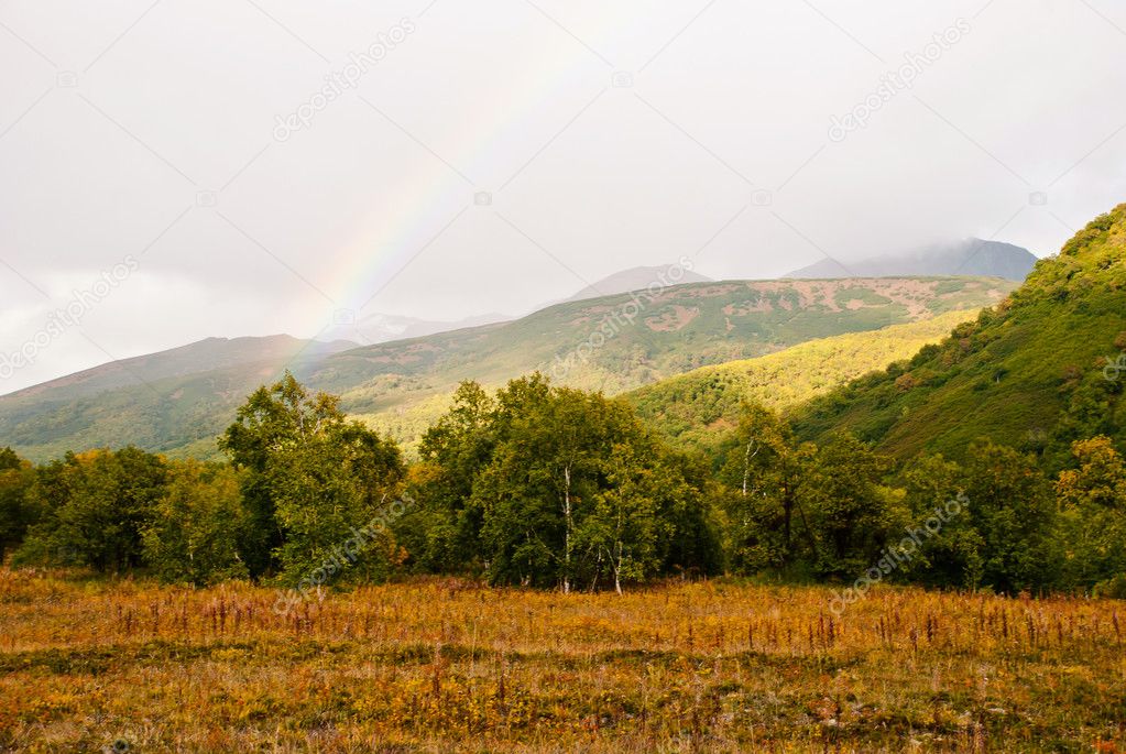 autumn landscape with rainbow