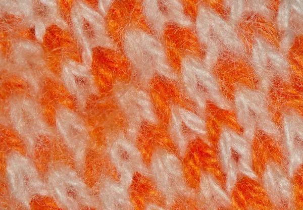 Gestricktes Stück orange und weißer Faden — Stockfoto