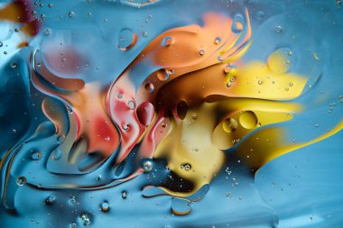 Abstract bright colorful background with streaks and bubbles. Multicolored fantasy. Selective soft focus.