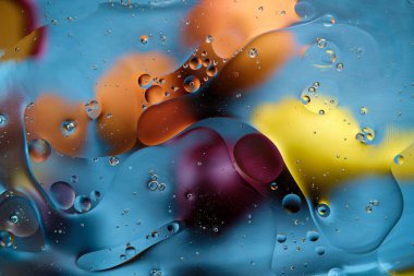 Abstract bright colorful background with streaks and bubbles. Multicolored fantasy. Selective soft focus.