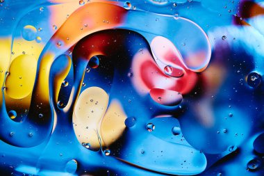 Abstract bright colorful background with streaks and bubbles. Multicolored fantasy. Selective soft focus.