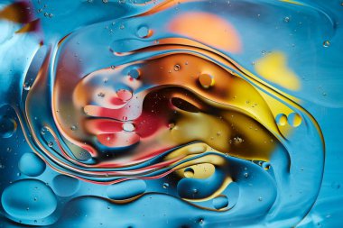 Abstract bright colorful background with streaks and bubbles. Multicolored fantasy. Selective soft focus.