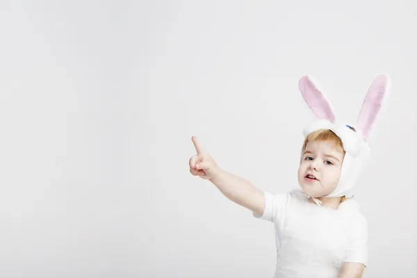 Cute young toddler boy wearing a bunny rabbit costume.Satisfied sly rabbit. Studio shot gray background. 2 year white easter rabbit — Stock Photo, Image