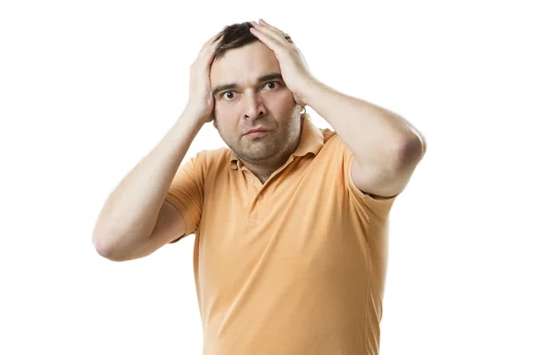 Young man holding his head in surprise. — Stock Photo, Image