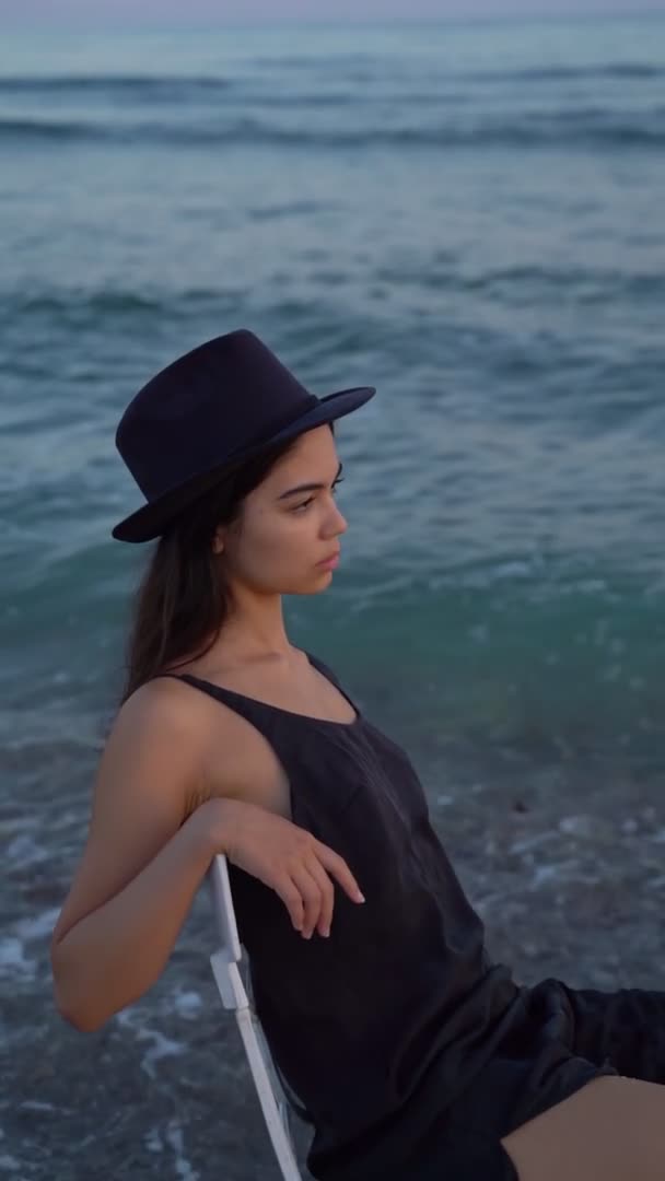 Slow Motion Video Portrait Beautiful Young Brunette Black Hat Sits — Video