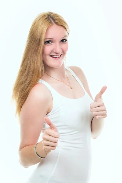 Long haired young woman thumbs up studio isolated oh white. — Stock Photo, Image