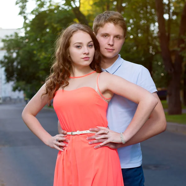 Young man and woman looking into tha camera — Stock Photo, Image