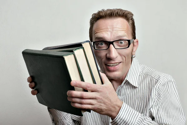 Smiling mid-aged student with old books from university library. — Stock Photo, Image