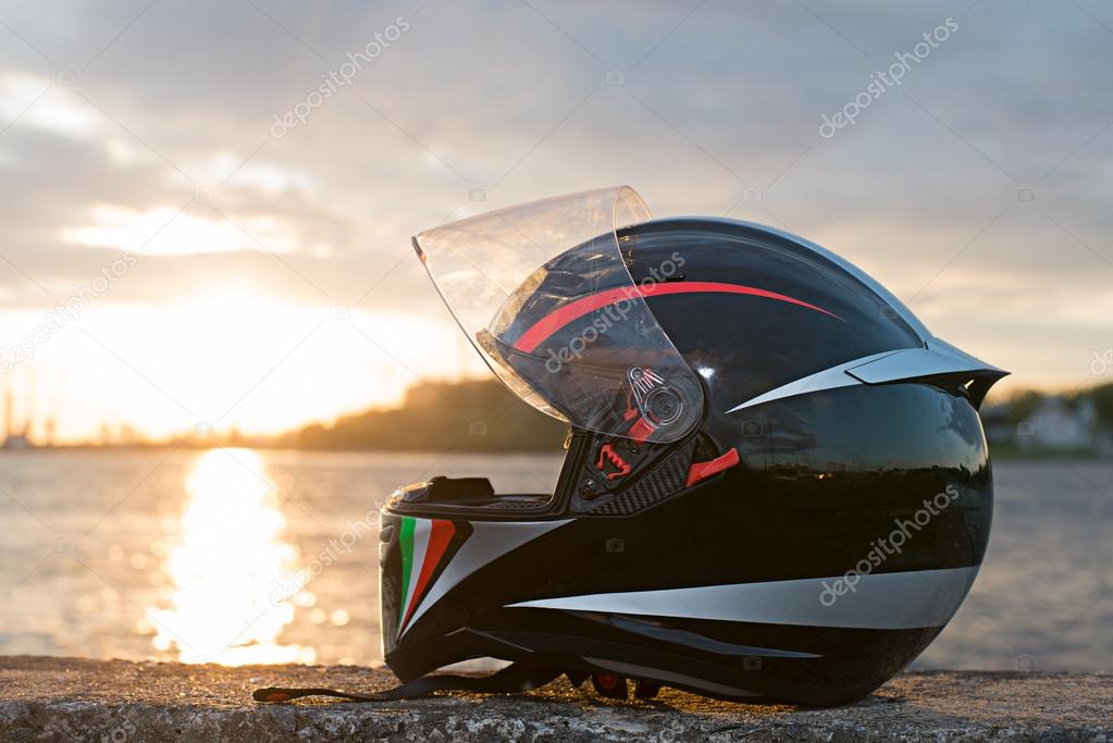 Moto Helmet on the beach at Sunset