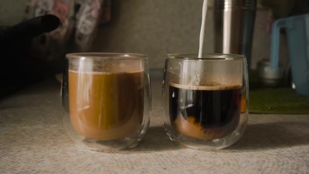 Kitchen Countertop Milk Poured Two Glasses Cups Double Bottom Black — Stock videók