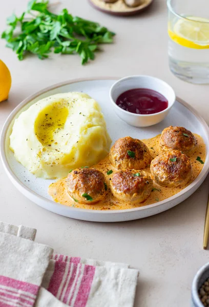 Swedish meatballs in cream sauce, potatoes and lingonberry sauce. Swedish cuisine. Recipe