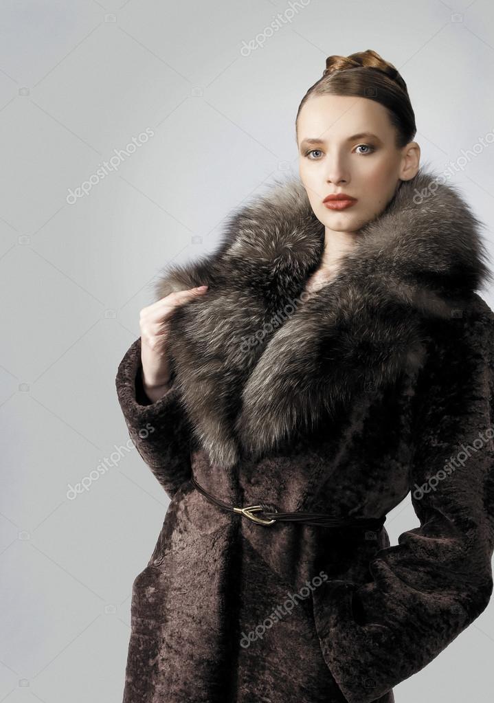 Beautiful models showing fur coat — Stock Photo © Ulianna #28893833
