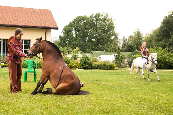 Two girls riding pony — Stock Photo, Image