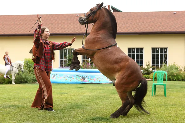 Two girls riding pony — Stock Photo, Image