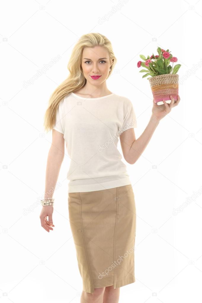 Beautiful Blond Busyness Woman Fashion Model with flower pot isolated on white.