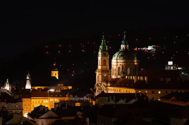 Prague at night, view of the Basilica of St. Mikulas, cityscape