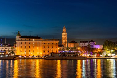 Evening city of Split in Croatia, reflection of the lights of the night city.