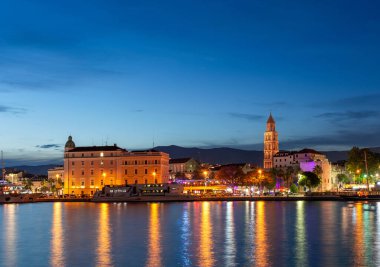 Evening city of Split in Croatia, reflection of the lights of the night city.