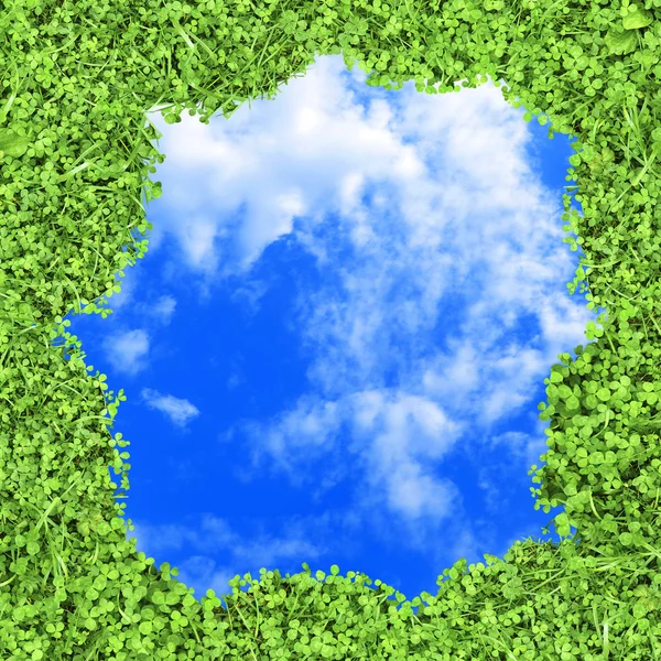 青空の背景に緑のジューシーな草のフレーム — ストック写真