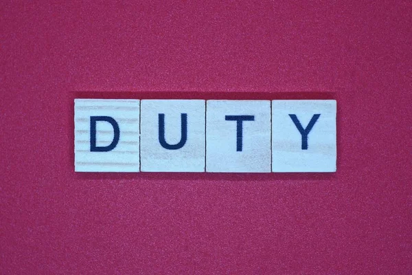 Word Duty Small Square Wooden Letters Pink Background — Stock Photo, Image