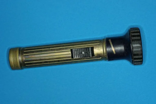 One Long Metal Old Gray Black Flashlight Lies Blue Table — Stock Photo, Image