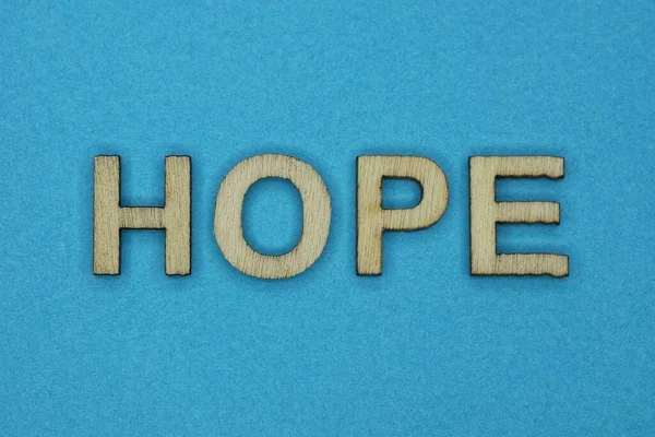 Šedé Slovo Naděje Malých Dřevěných Písmen Modrém Pozadí — Stock fotografie