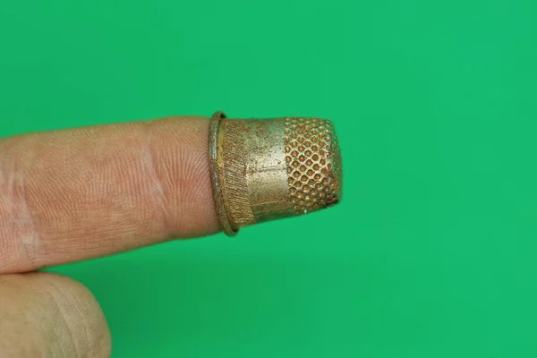 One Old Small Steel Thimble Finger Green Background — Stock Photo, Image