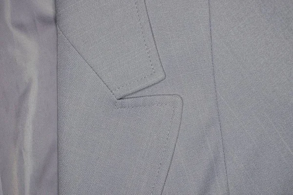 襟と裏地のあるグレーのコートの一部から生地の質感 — ストック写真