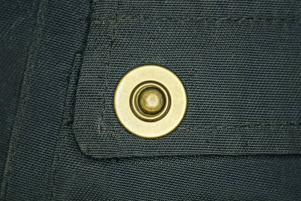 One Yellow Metal Rivet Black Jacket Fabric — Stock Photo, Image