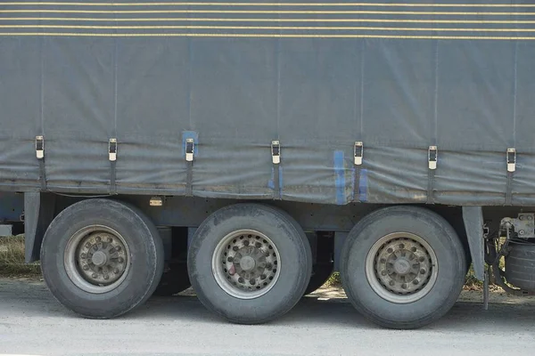 Three Black Wheels Gray Large Canvas Truck Trailer Street Asphalt — Stock Photo, Image