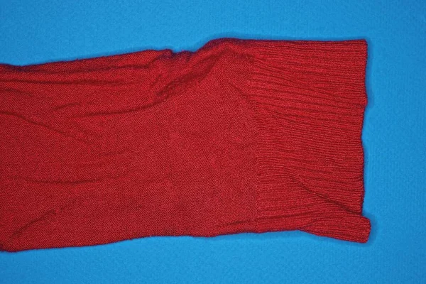 One Red Long Sleeve Woolen Sweater Lies Blue Table — Photo