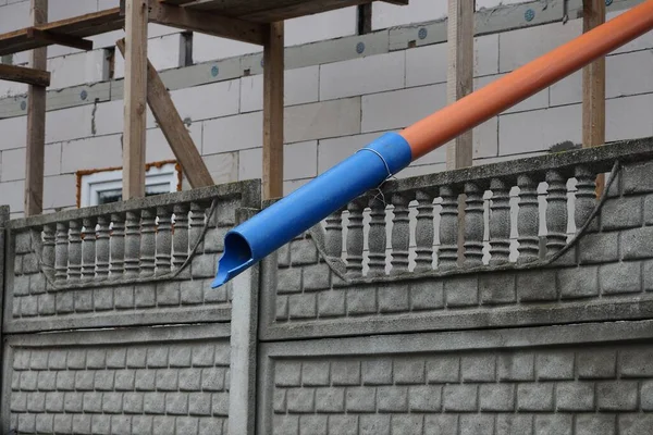 One Long Plastic Blue Brown Chimney Pipe Gray Concrete Wall — Stock Fotó