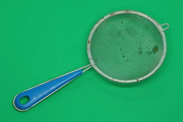 One Old Gray Metal Sieve Rust Blue Plastic Handle Lies — Foto Stock