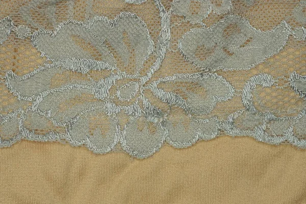Kalıplı bir kumaş parçasından gri kahverengi doku.
