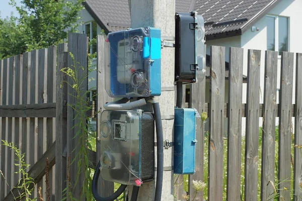 Blue Gray Electric Meters Hang Concrete Pole Wooden Fence Street — Fotografia de Stock