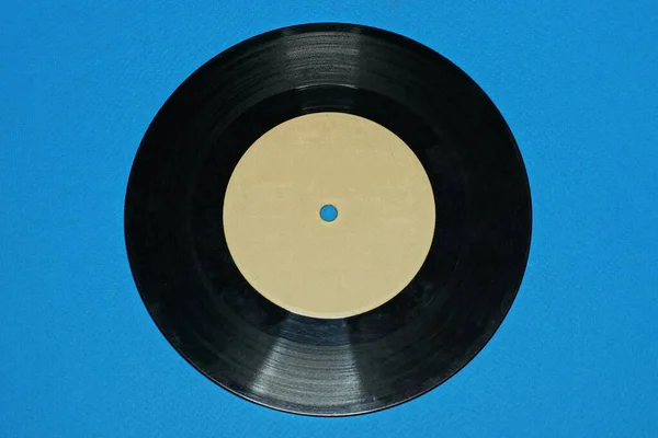 One Old Black Gray Vinyl Record Lies Blue Table — Fotografia de Stock