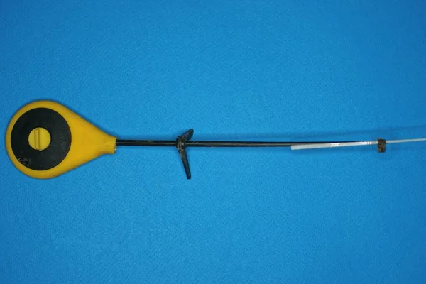 One Small Plastic Yellow Black Winter Fishing Rod Lies Blue — Stok fotoğraf