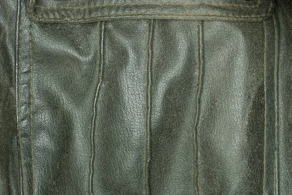 旧夹克口袋里的黑色皮革质地 — 图库照片