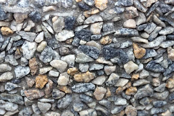Šedohnědá Textura Malých Kamenů Zdi Plotu Ulici — Stock fotografie