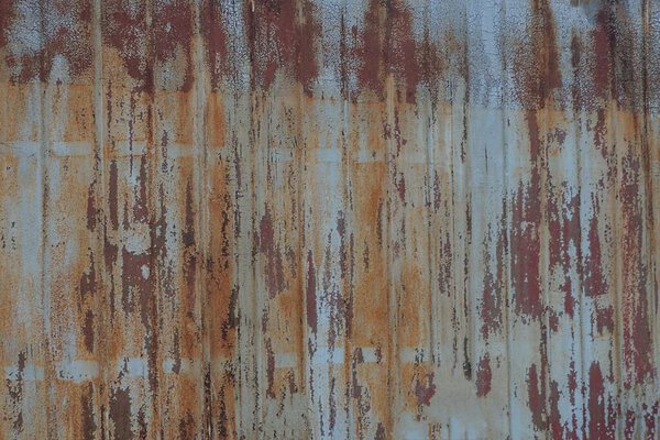 Gray brown metal background from rusty old worn wall