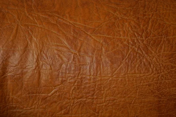 一件衣服上的褐色红色皮革纹理 — 图库照片